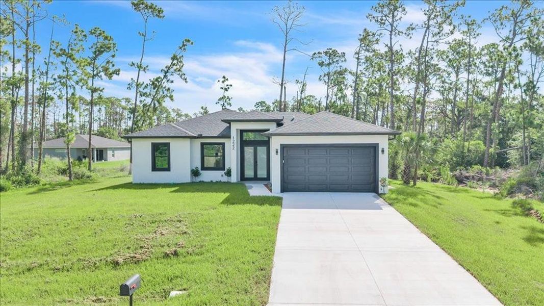 Front exterior of a new home in , Port Charlotte, FL, highlighting curb appeal (Image 24). Front exterior of a new home in , Port Charlotte, FL, highlighting curb appeal (Image 24).