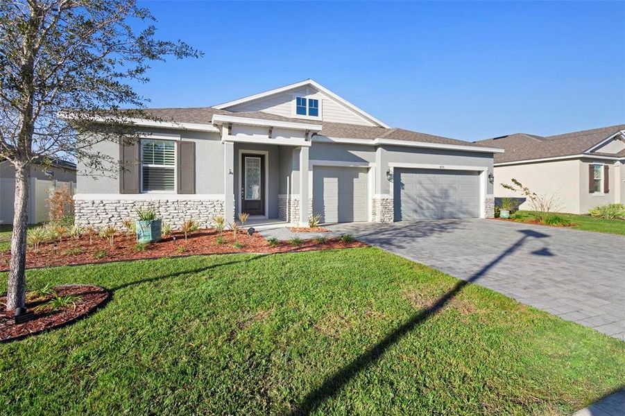 Front exterior of a new home in Addison Landing, Deland, FL, highlighting curb appeal (Image 29).