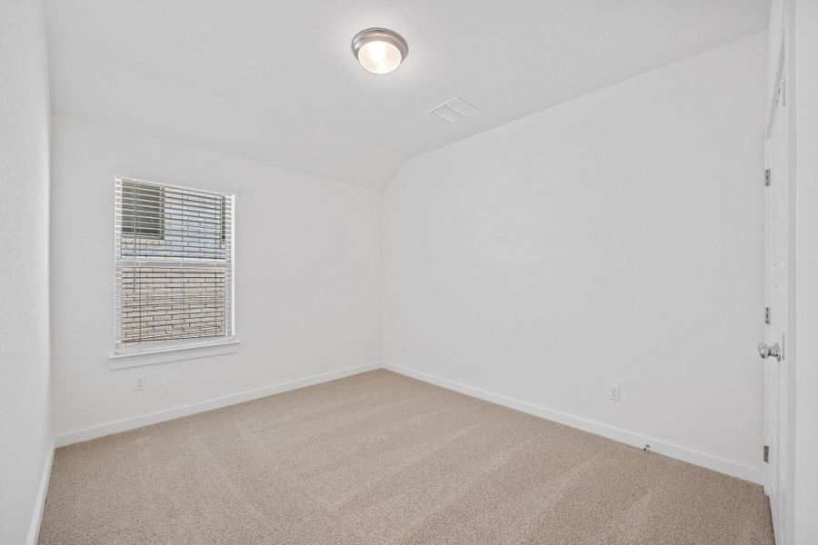 Bedroom in the Oak home plan by Trophy Signature Homes – REPRESENTATIVE PHOTO Bedroom in the Oak home plan by Trophy Signature Homes – REPRESENTATIVE PHOTO