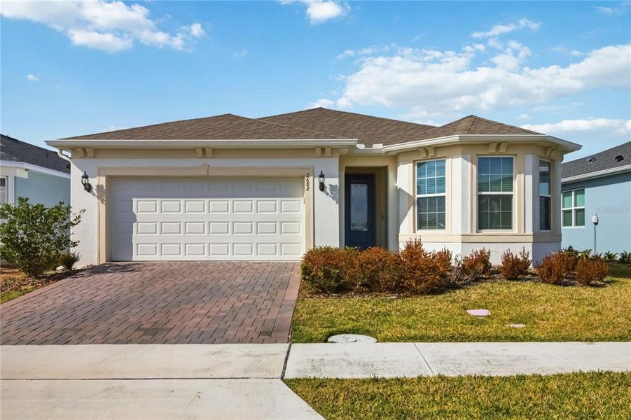 Front exterior of a new home in , St. Cloud, FL, highlighting curb appeal (Image 25).