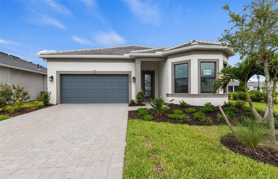 Front exterior of a new home in Del Webb Catalina, Lakewood Ranch, FL, highlighting curb appeal (Image 22). Front exterior of a new home in Del Webb Catalina, Lakewood Ranch, FL, highlighting curb appeal (Image 22).