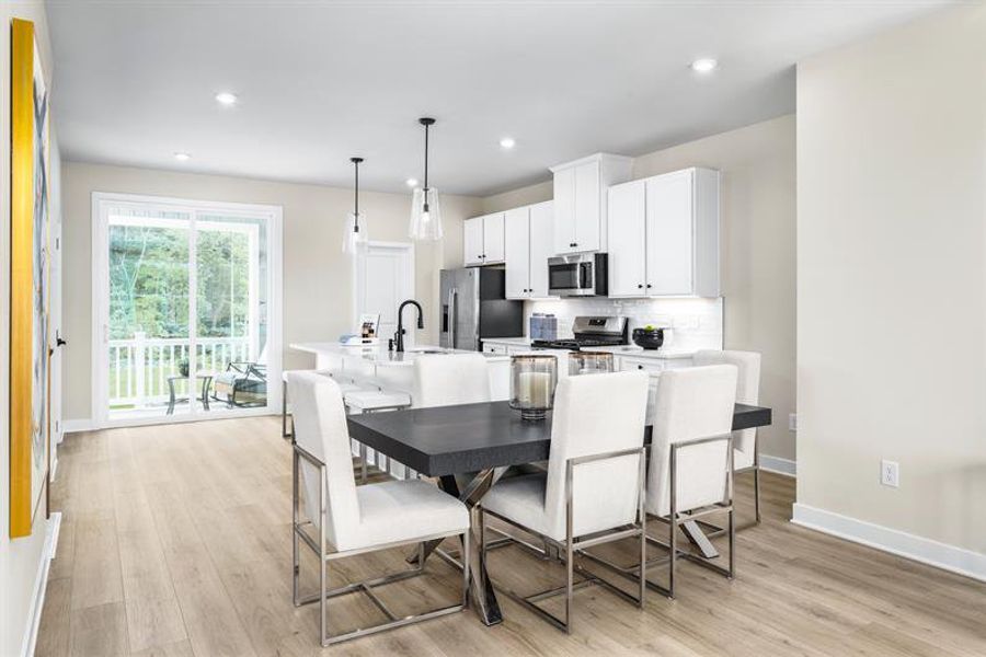 Representative furnished interior of a home built from the Schuman by Ryan Homes in Stowe Branch Townhomes, Charlotte (Image 7).