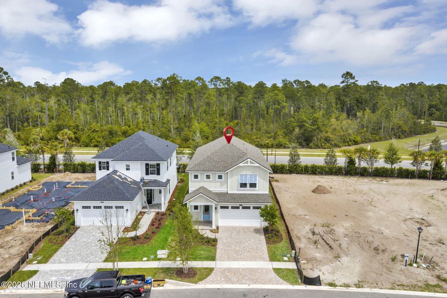 Front exterior of a new home in Seabrook Village at Seabrook, Ponte Vedra, FL, highlighting curb appeal (Image 1). Front exterior of a new home in Seabrook Village at Seabrook, Ponte Vedra, FL, highlighting curb appeal (Image 1).