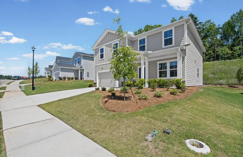 Front exterior of a new home in Avery Ridge, Gainesville, GA, highlighting curb appeal (Image 2). Front exterior of a new home in Avery Ridge, Gainesville, GA, highlighting curb appeal (Image 2).