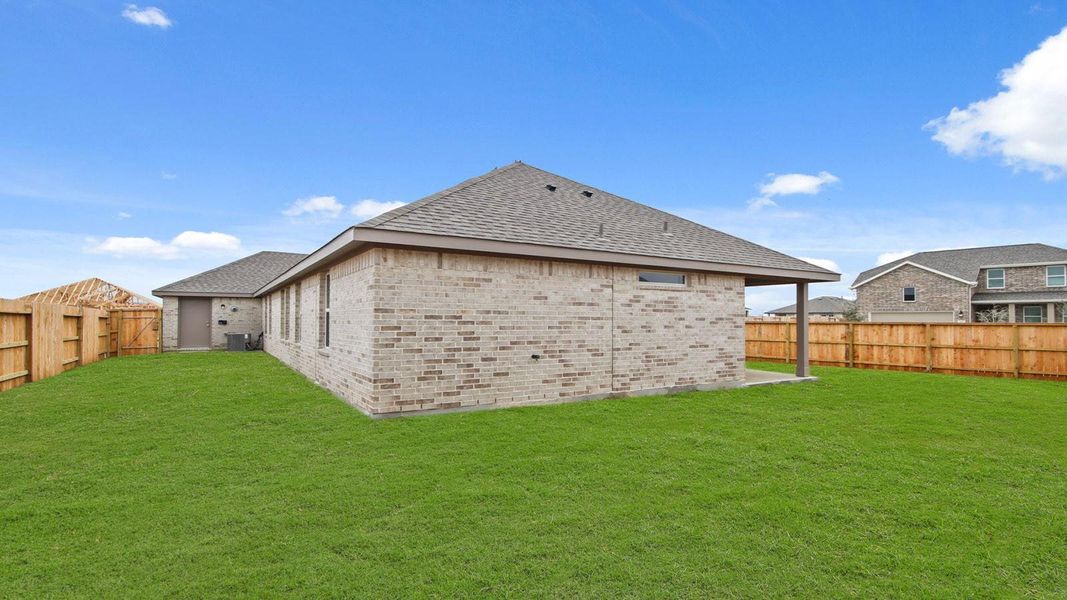 Front exterior of a new home in River Ranch Meadows, Dayton, TX, highlighting curb appeal (Image 15).