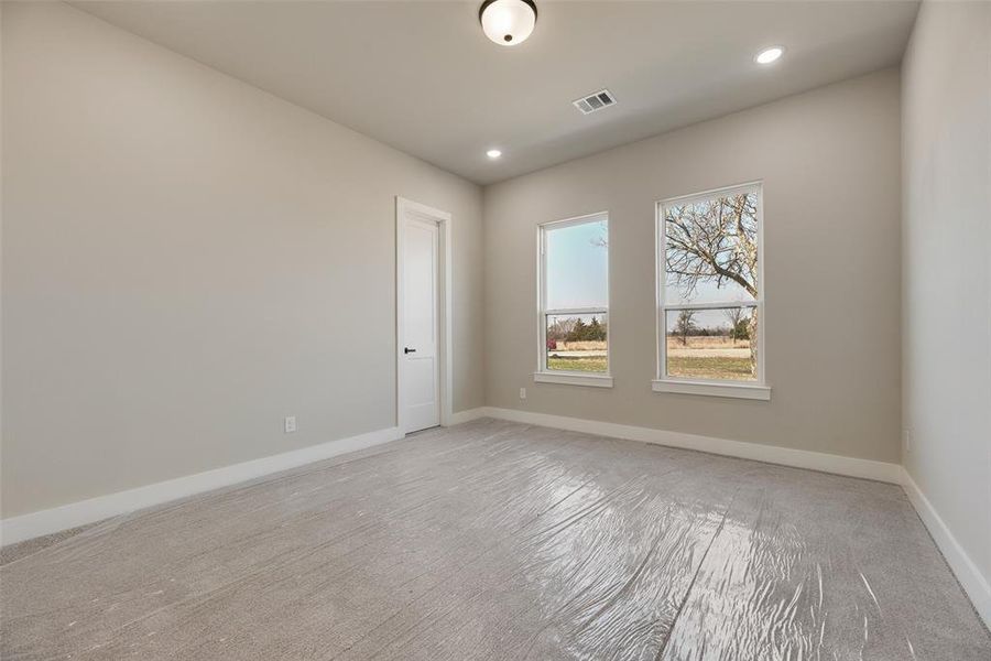 Unfurnished room featuring baseboards and recessed lighting