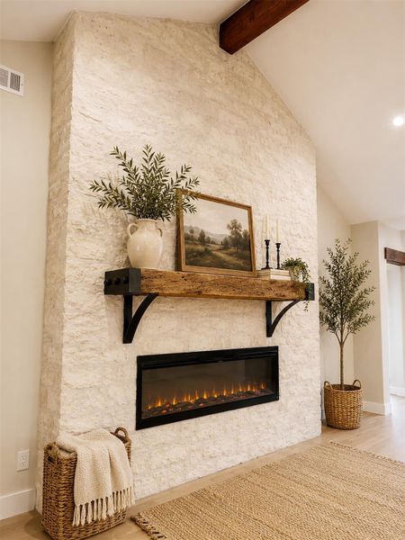 A floor-to-ceiling textured stone fireplace commands attention beneath soaring vaulted ceilings with exposed wood beams.Virtual Staging. A floor-to-ceiling textured stone fireplace commands attention beneath soaring vaulted ceilings with exposed wood beams.Virtual Staging.
