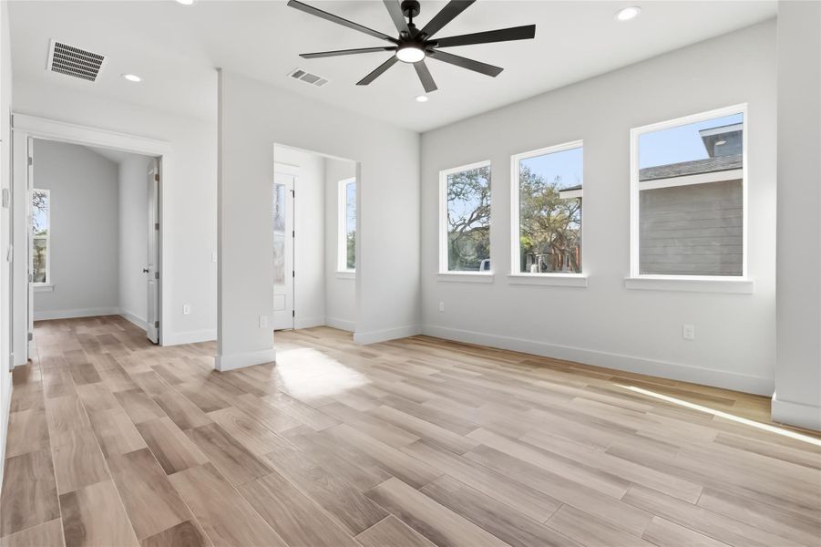 Living area with views of entry way and dedicated office