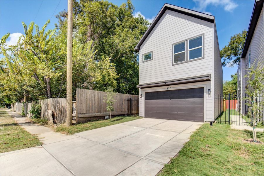 Front exterior of a new home in , Houston, TX, highlighting curb appeal (Image 1).