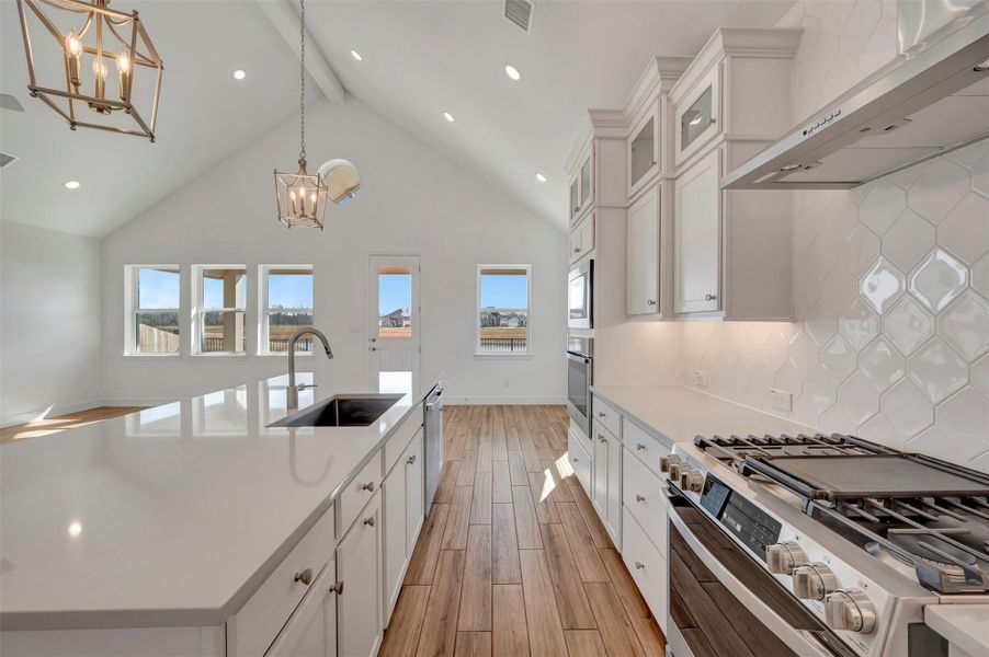 Stunning kitchen with white stacked cabinets and quartz counter Stunning kitchen with white stacked cabinets and quartz counter