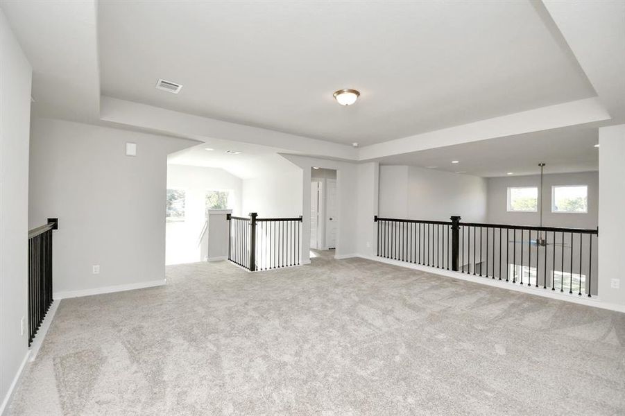 Come upstairs and enjoy a day of leisure in this fabulous game room! This is the perfecthangout spot or adult game room! Features plush carpet, high ceilings, custom paint andwindows for plenty of natural light.