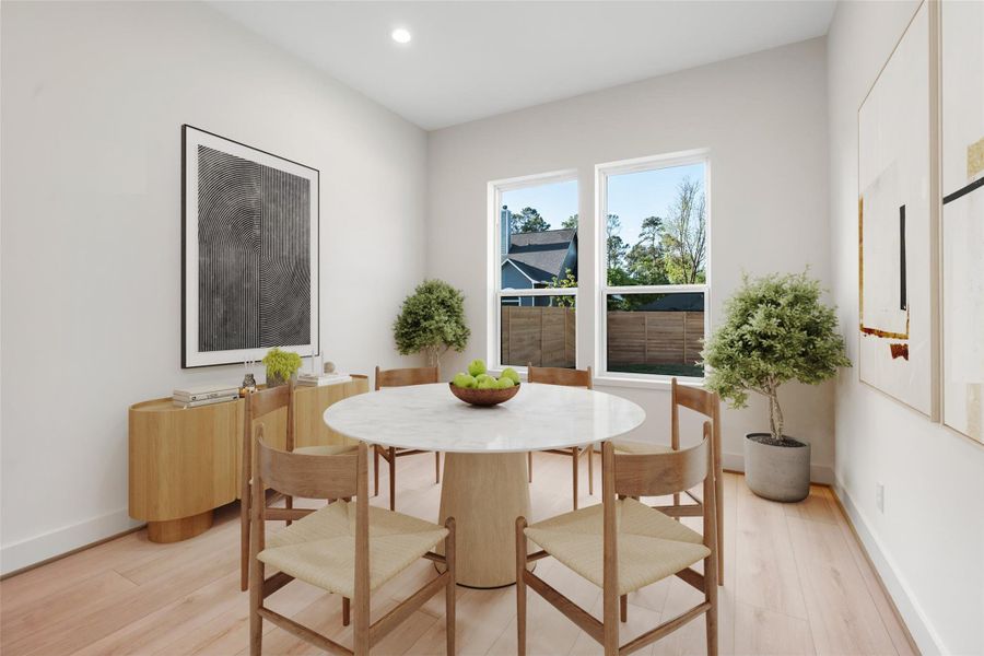 The casual dining area offers a comfortable, light-filled space ideal for everyday meals, with a relaxing view of the backyard that enhances the home's seamless indoor-outdoor living. Virtually staged. The casual dining area offers a comfortable, light-filled space ideal for everyday meals, with a relaxing view of the backyard that enhances the home's seamless indoor-outdoor living. Virtually staged.