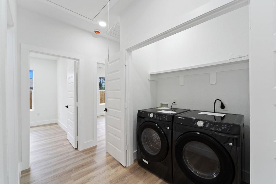 Tucked in nicely is the utility room with enough space to fit separate washer and dryer machines.