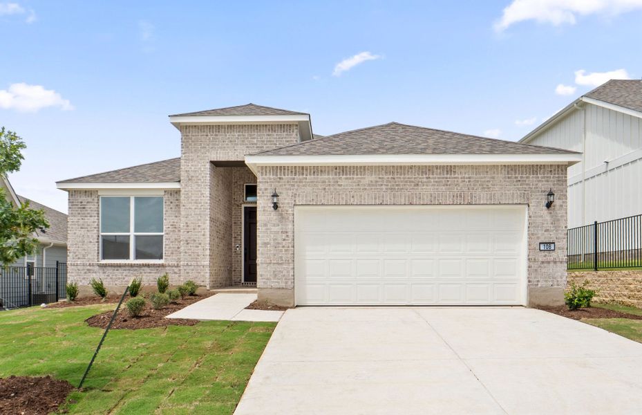 Front exterior of a new home in Sun City Texas, Georgetown, TX, highlighting curb appeal (Image 21).