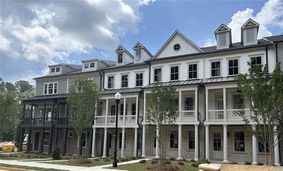 Front exterior of a new home in Devin's Shire - A Kennesaw Tradition, Kennesaw, GA, highlighting curb appeal (Image 18). Front exterior of a new home in Devin's Shire - A Kennesaw Tradition, Kennesaw, GA, highlighting curb appeal (Image 18).