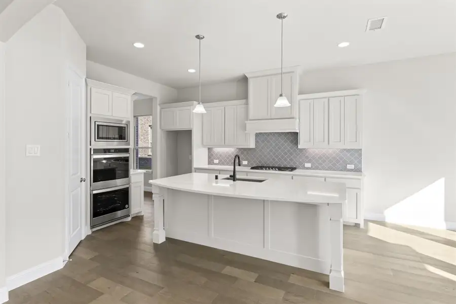 Representative furnished interior of a home built from the Portsmouth by Windsor Homes in Nelson Lake Estates, Rockwall (Image 10).