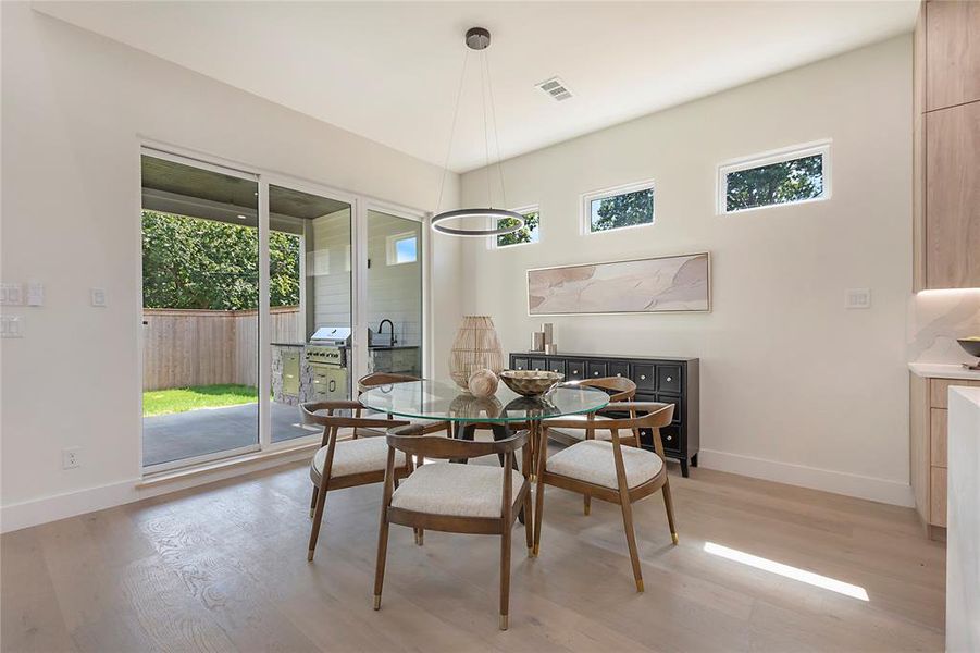 Dining space with wood-type flooring