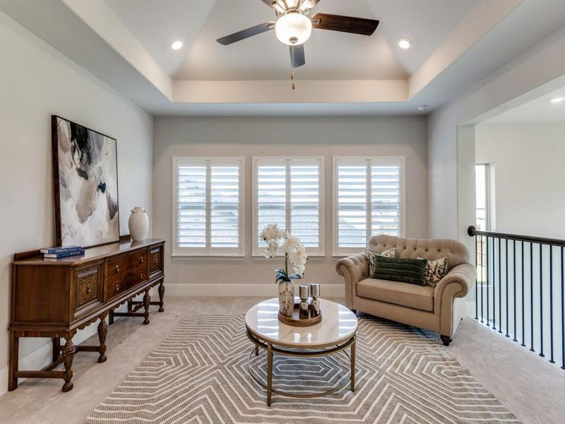 Living room featuring light carpet, a ceiling fan, and recessed lighting