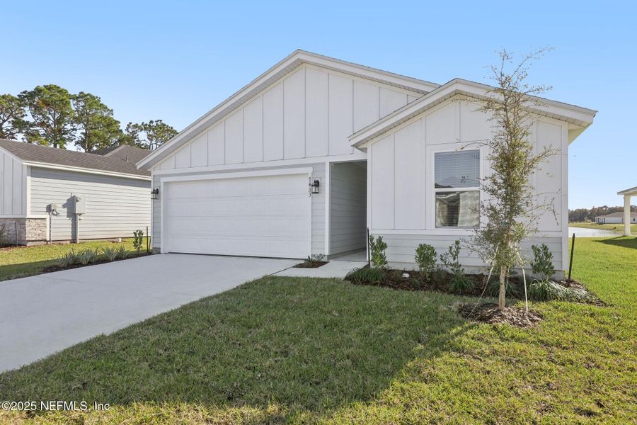 Front exterior of a new home in Cypress Meadows - Signature Series, Jacksonville, FL, highlighting curb appeal (Image 19).