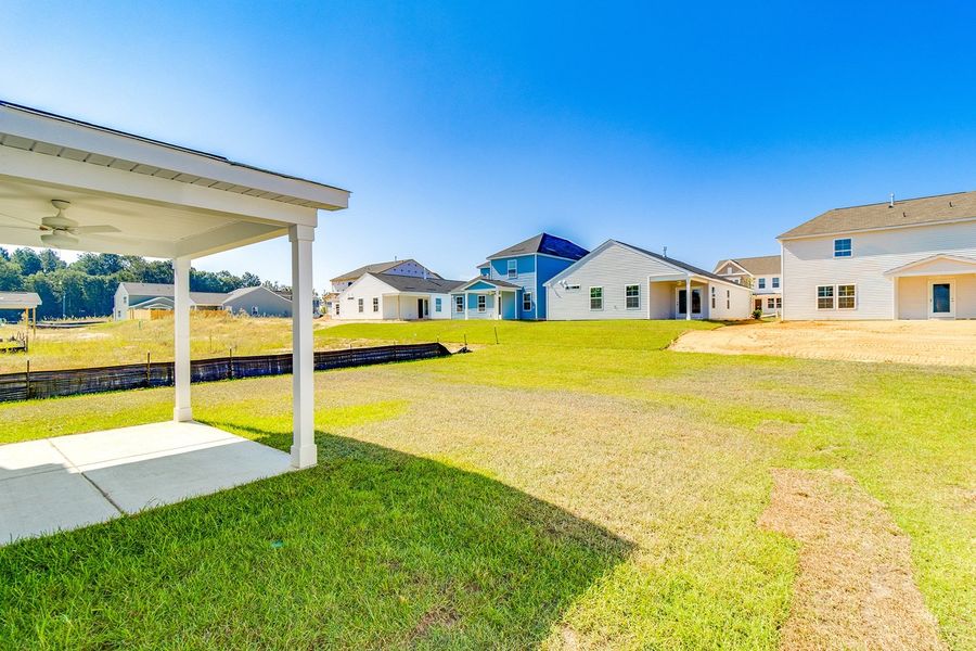 Front exterior of a new home in Winston Point, Gilbert, SC, highlighting curb appeal (Image 20).