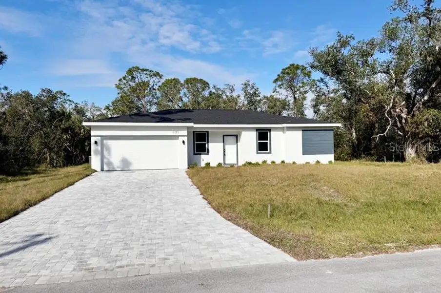 Front exterior of a new home in , Port Charlotte, FL, highlighting curb appeal (Image 17). Front exterior of a new home in , Port Charlotte, FL, highlighting curb appeal (Image 17).