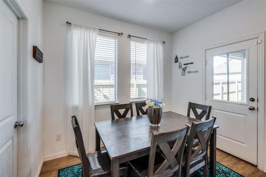 Dining space with wood-type flooring