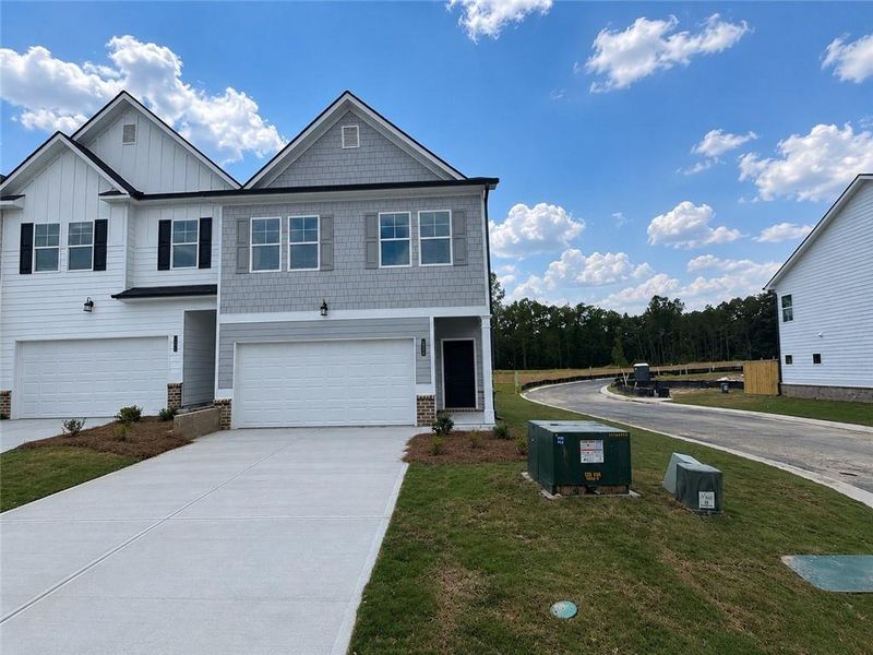 Front exterior of a new home in Sandtown Falls, Atlanta, GA, highlighting curb appeal (Image 2). Front exterior of a new home in Sandtown Falls, Atlanta, GA, highlighting curb appeal (Image 2).