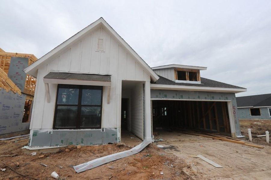 Front exterior of a new home in Austin Point, Richmond, TX, highlighting curb appeal (Image 1). Front exterior of a new home in Austin Point, Richmond, TX, highlighting curb appeal (Image 1).