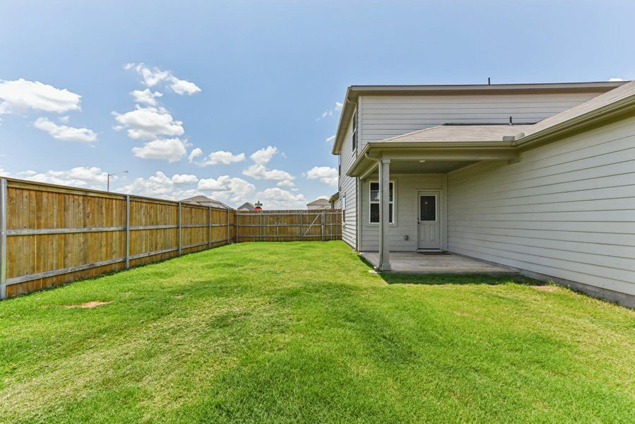 Exterior details and patio area of a home in Stonewall Ranch, Liberty Hill (Image 25).