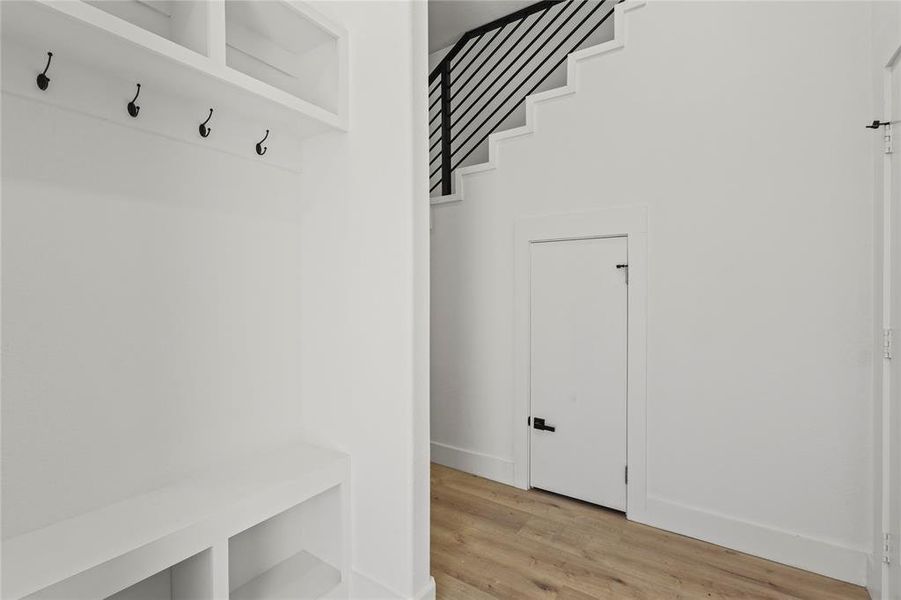 Mudroom with light wood-style flooring