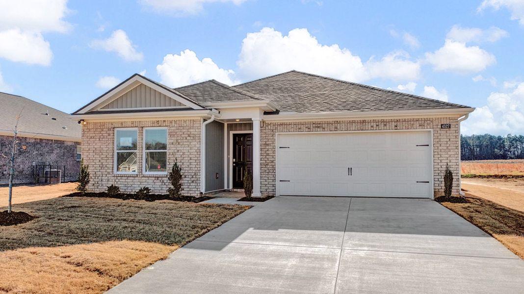 Front exterior of a new home in Huntington Estates, Millington, TN, highlighting curb appeal (Image 1). Front exterior of a new home in Huntington Estates, Millington, TN, highlighting curb appeal (Image 1).