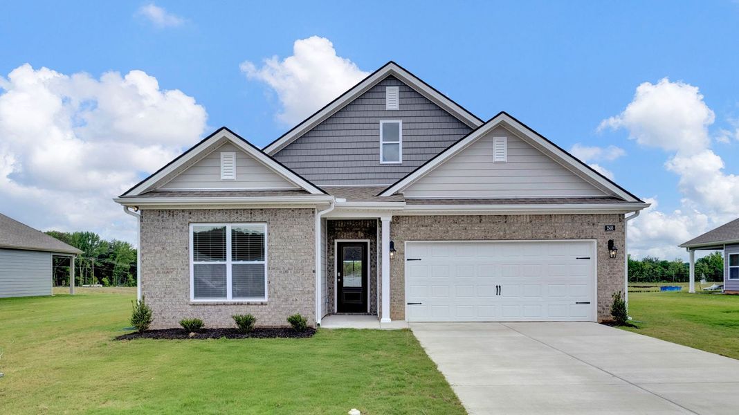 Front exterior of a new home in The Orchard, Millington, TN, highlighting curb appeal (Image 2). Front exterior of a new home in The Orchard, Millington, TN, highlighting curb appeal (Image 2).
