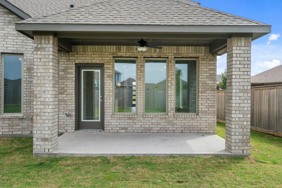 Exterior details and patio area of a home in Bridgeland, Cypress (Image 22).