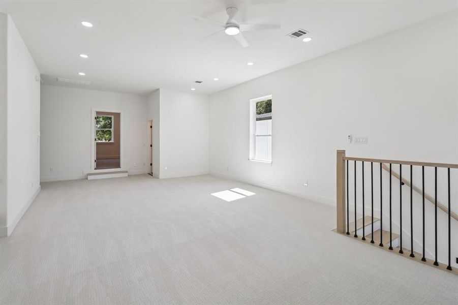Unfurnished room featuring light colored carpet, recessed lighting, and a ceiling fan