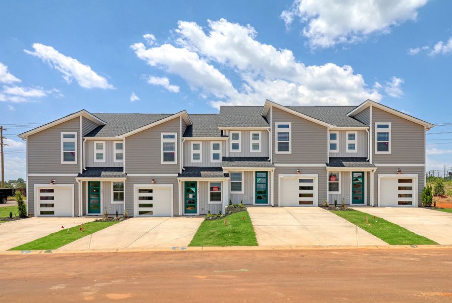 Representative exterior photo of a completed home built from the Ivey by Hunter Quinn Homes in Westgate Village Townes, Spartanburg, SC (Image 24). Representative exterior photo of a completed home built from the Ivey by Hunter Quinn Homes in Westgate Village Townes, Spartanburg, SC (Image 24).