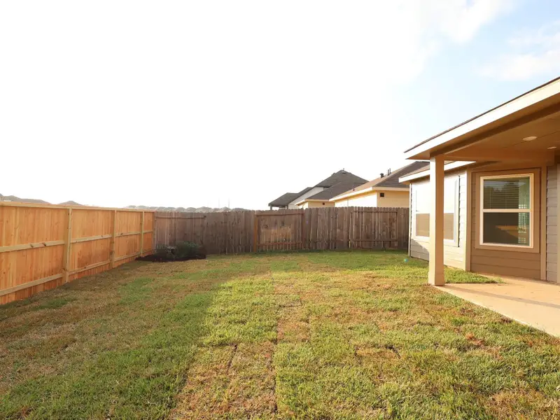 Exterior details and patio area of a home in Magnolia Ridge, Magnolia (Image 3). Exterior details and patio area of a home in Magnolia Ridge, Magnolia (Image 3).