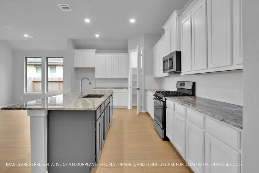 Furnished interior view inside a new home in River Ranch 55', Dayton (Image 5).