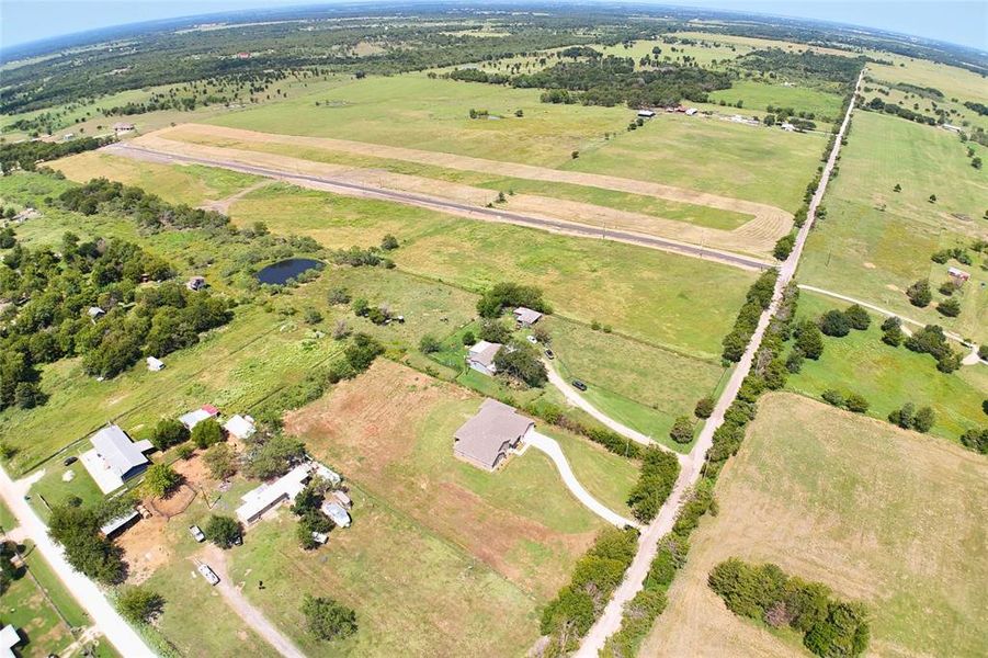 Aerial view of property's location featuring rural landscape