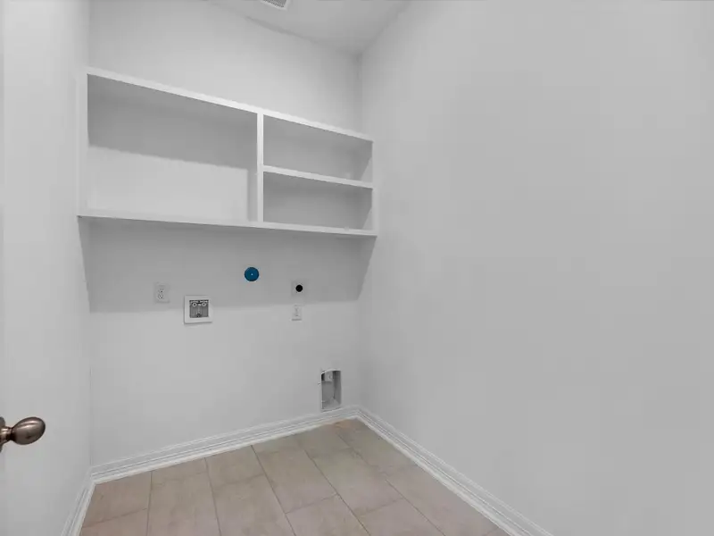 Laundry room. Sample product photo. Actual exterior and interior selections may vary by homesite. Photo may be virtually staged.
