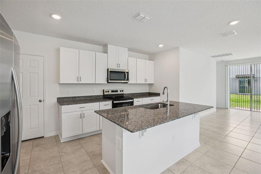 Furnished interior view inside a new home in Villamar - Classic Series, Winter Haven (Image 13).