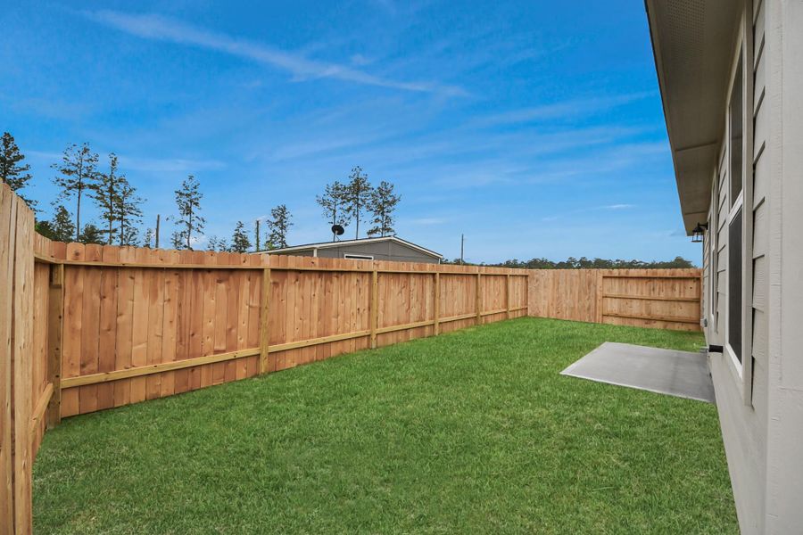 Exterior details and patio area of a home in The Enclave at Spring Branch, Montgomery (Image 21). Exterior details and patio area of a home in The Enclave at Spring Branch, Montgomery (Image 21).