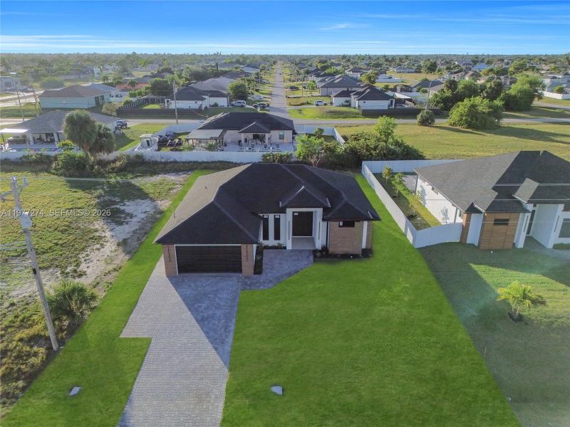 Front exterior of a new home in , Cape Coral, FL, highlighting curb appeal (Image 28).