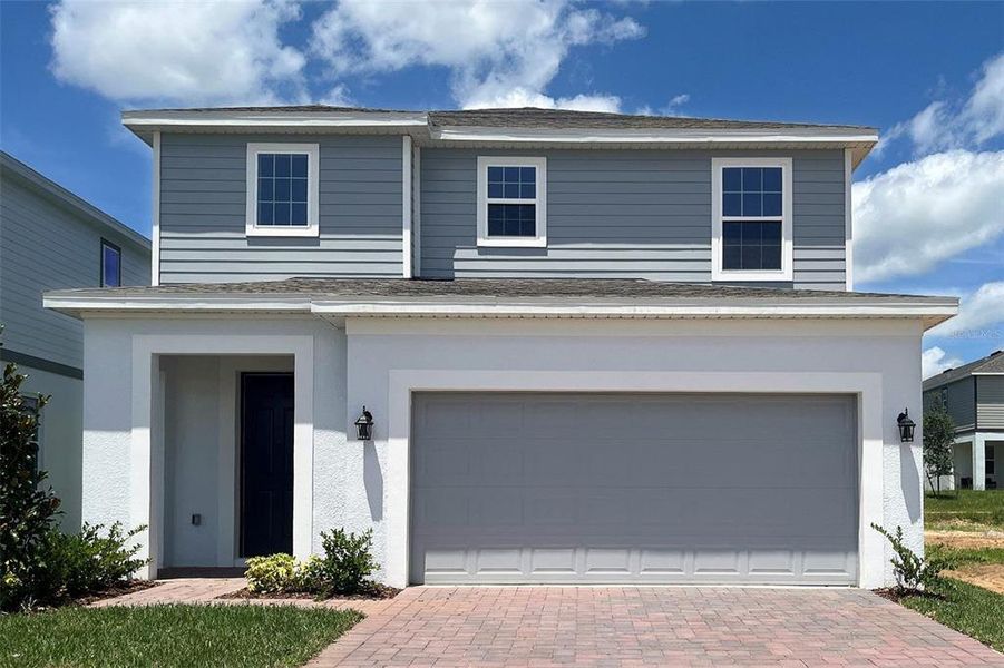 Front exterior of a new home in Trinity Lakes, Groveland, FL, highlighting curb appeal (Image 1). Front exterior of a new home in Trinity Lakes, Groveland, FL, highlighting curb appeal (Image 1).