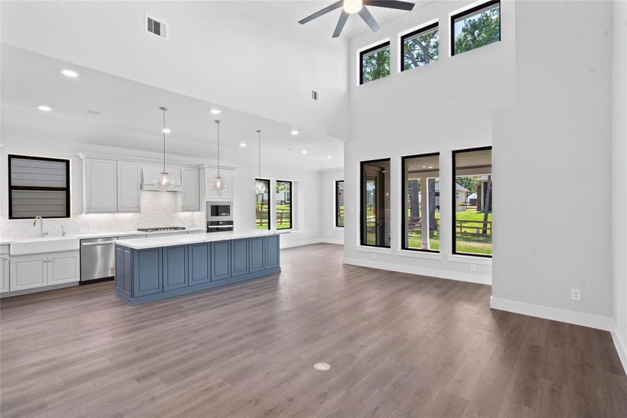 Stunning open-concept design seamlessly connecting the living, dining, and kitchen areas—perfect for both everyday living and entertaining!