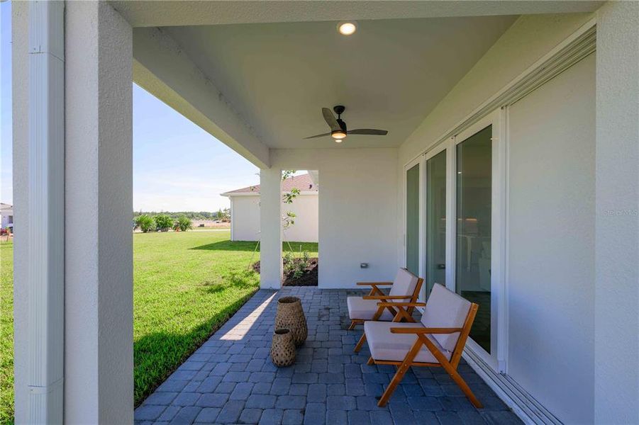 Exterior details and patio area of a home in Brystol North at Wylder, Port St. Lucie (Image 7).