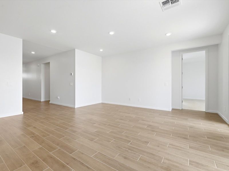Spacious, unfurnished interior of a new home in White Tank Foothills Signature Series, Waddell (Image 10).
