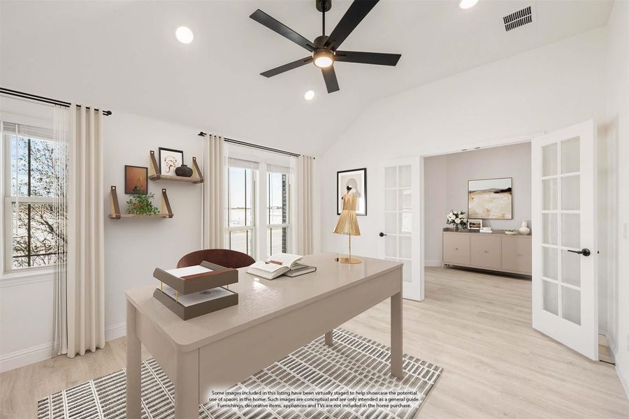 Home office with vaulted ceiling, ceiling fan, hardwood floors, and French doors leading to an adjacent room.