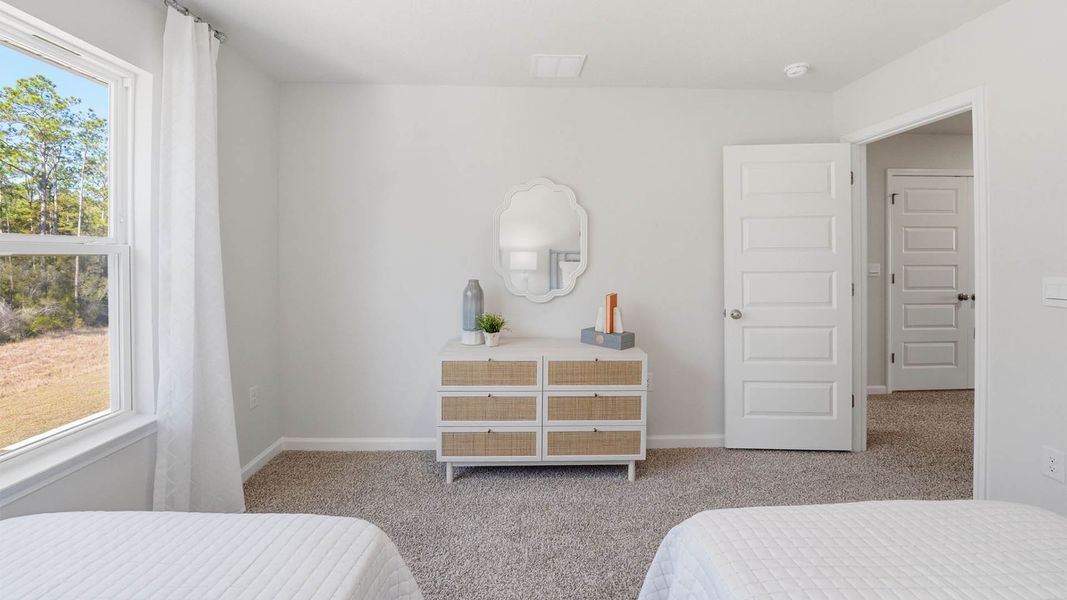 Representative furnished interior of a home built from the The Monroe by D.R. Horton in Chateau Nemours, Port Saint Joe (Image 20).