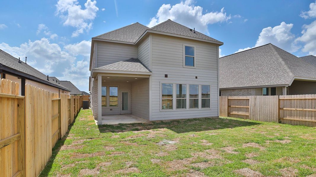 Front exterior of a new home in The Grand Prairie 40', Hockley, TX, highlighting curb appeal (Image 12). Front exterior of a new home in The Grand Prairie 40', Hockley, TX, highlighting curb appeal (Image 12).