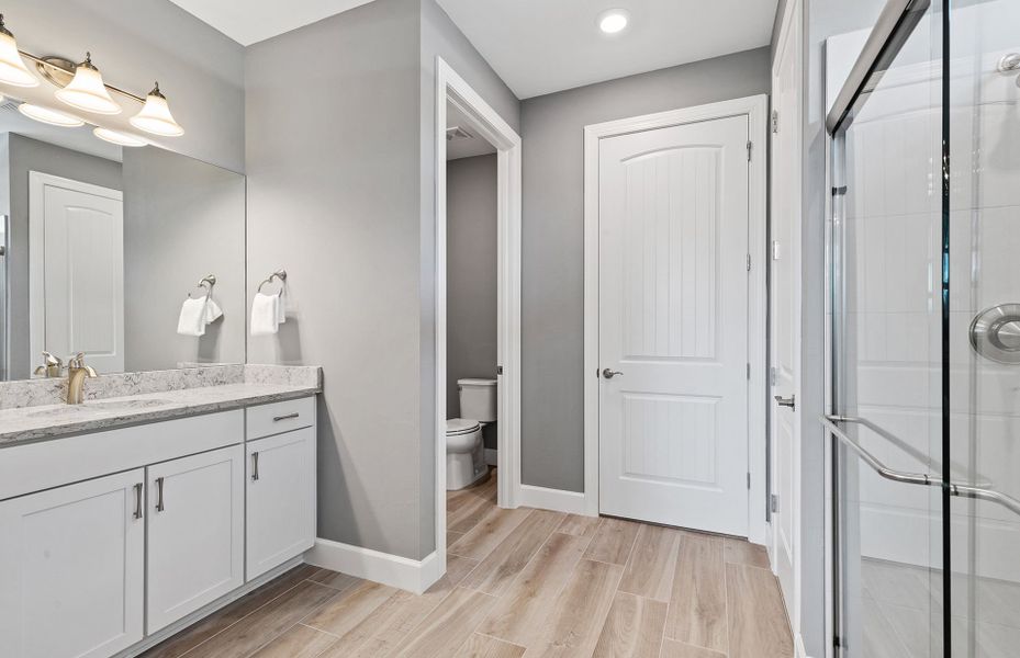 Bathroom with designer finishes and walk-in closet